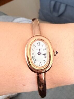 Rose Gold-Tone Oval Bracelet Watch with White Dial and blue crown.